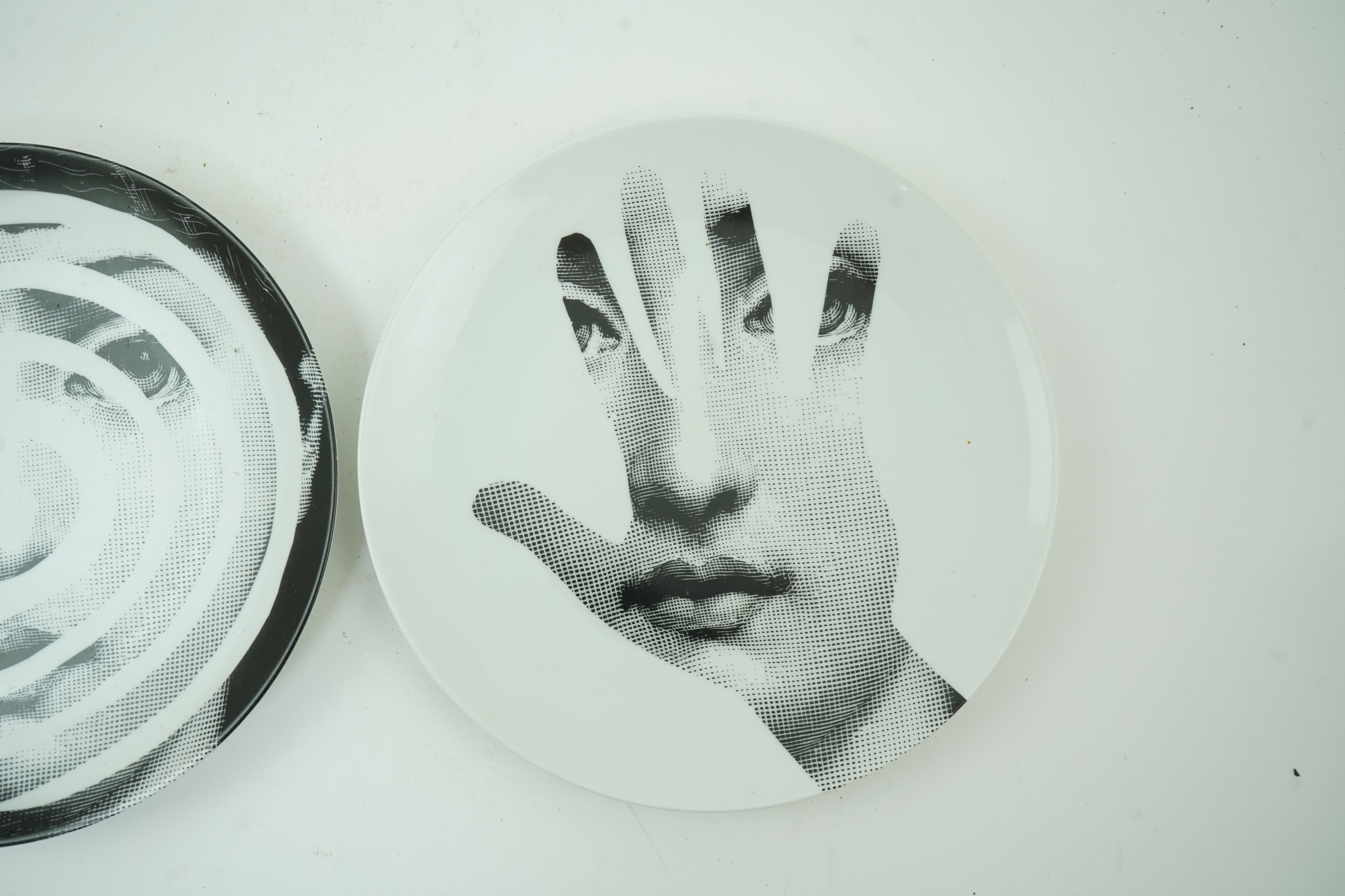 Piero Fornasetti (Italian, 1913-1988): Two 'Tema a Variazioni' plates